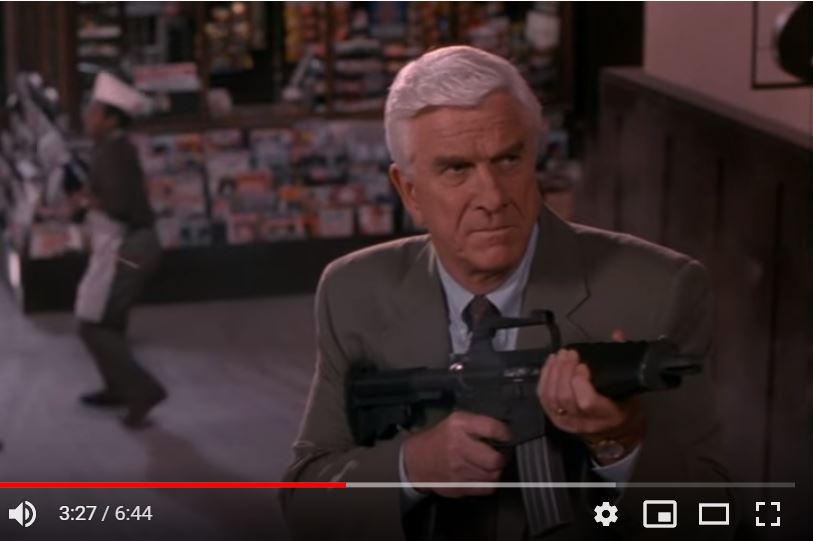 The M16k portrayed in the opening shootout of the Naked Gun 33 1/3 movie. Yes, that's OJ Simpson juggling babies n the background
