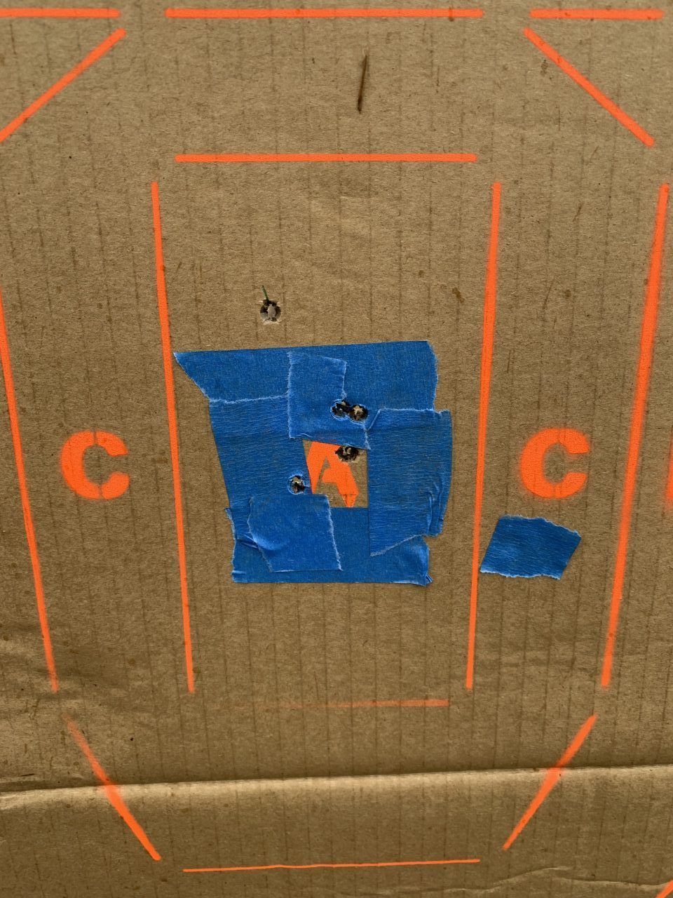 Outside of the tape was a previous shot, the four shot group was my final sight in group at 50 yards! 