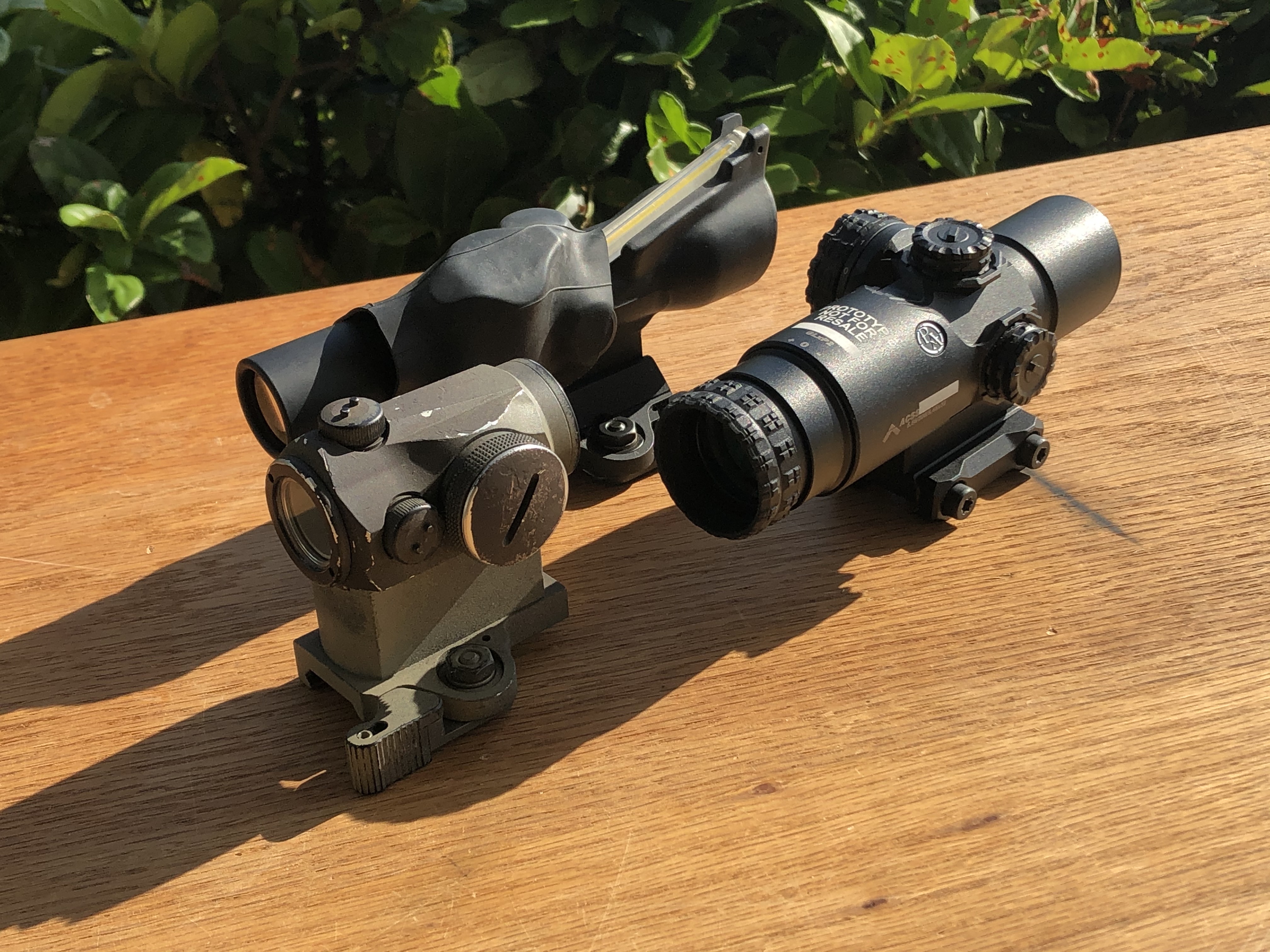 The Three Amigos: A TA-45-2 ACOG (with a keychaing light under a section of innertube to help brighten it up), An Aimpoint mini-red dot, and the PA GLx 2x Prism