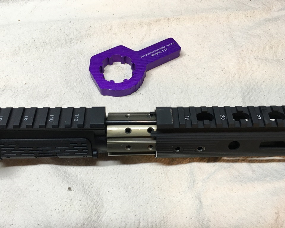 Once installed with the purple barrel nut wrench, the handguard slides on and is bolted down to the sturdy barrel nut. It's a perfet and precise fit.