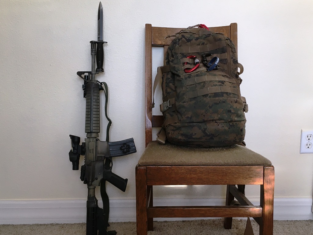 The bayonet is on the rifle. And the chair is against the wall. The bayonet barely fits this 14.5" midlength with a pinned extended flash hider. but it DOES fit.