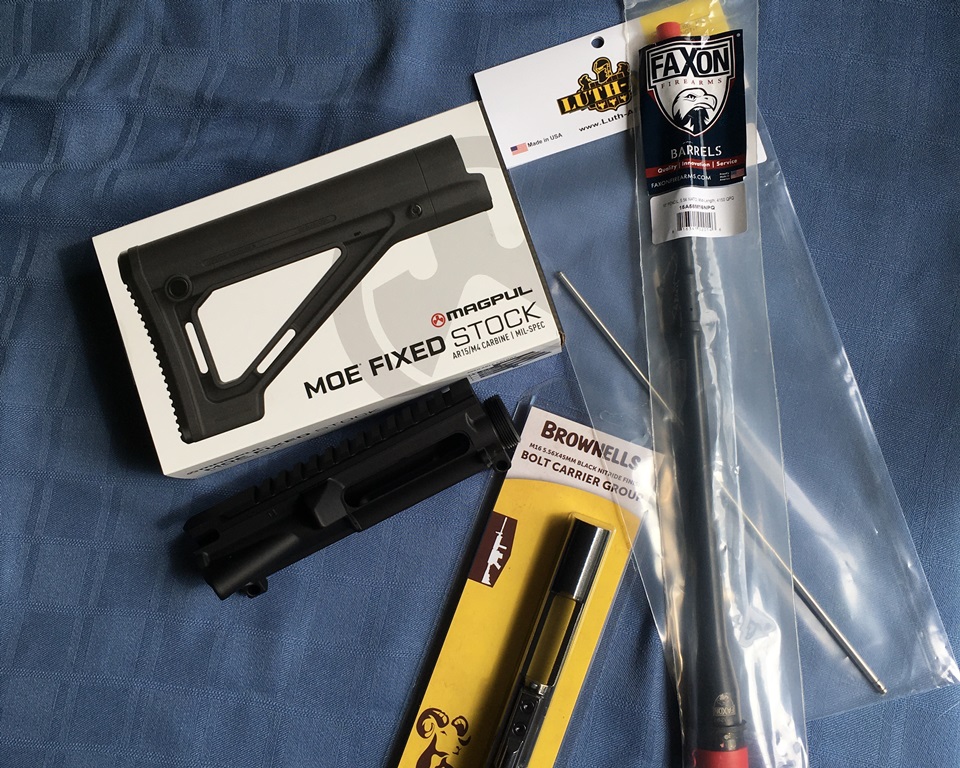 Parts from Brownells: Faxon pencil barrel, Magpul MOE Fixed stock, Brownells upper receiver and bolt carrier group, and a mid-length gas tube. 